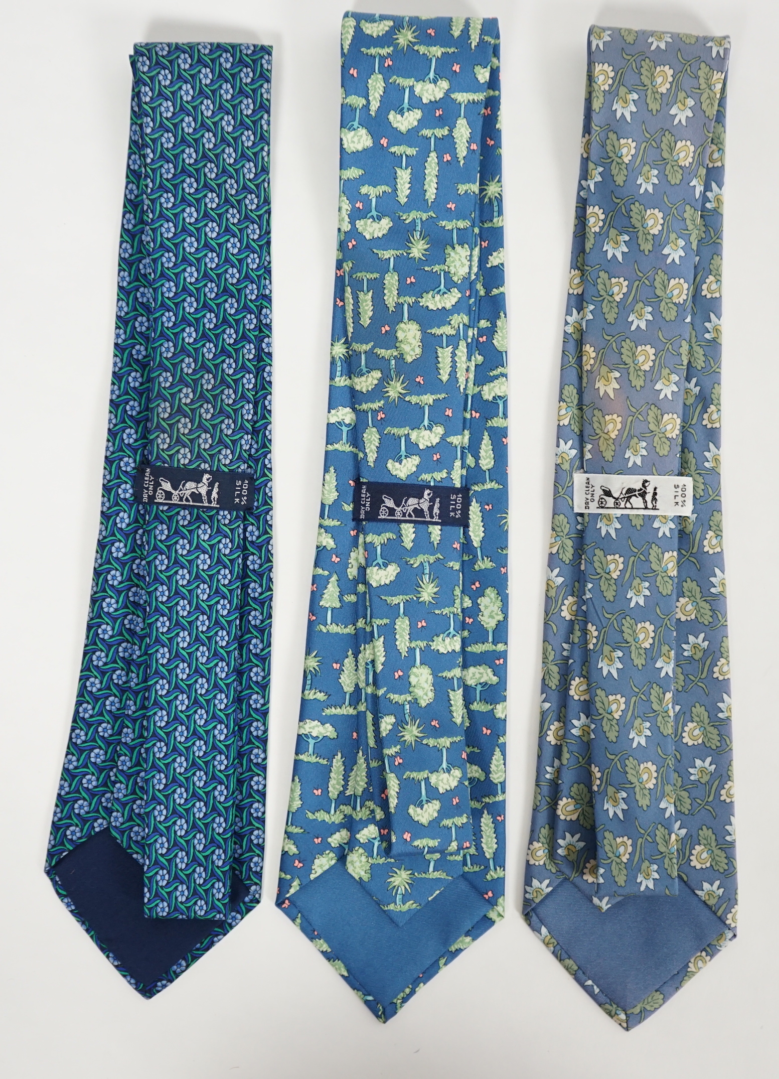 Three Hermès gentlemen's assorted patterned silk ties